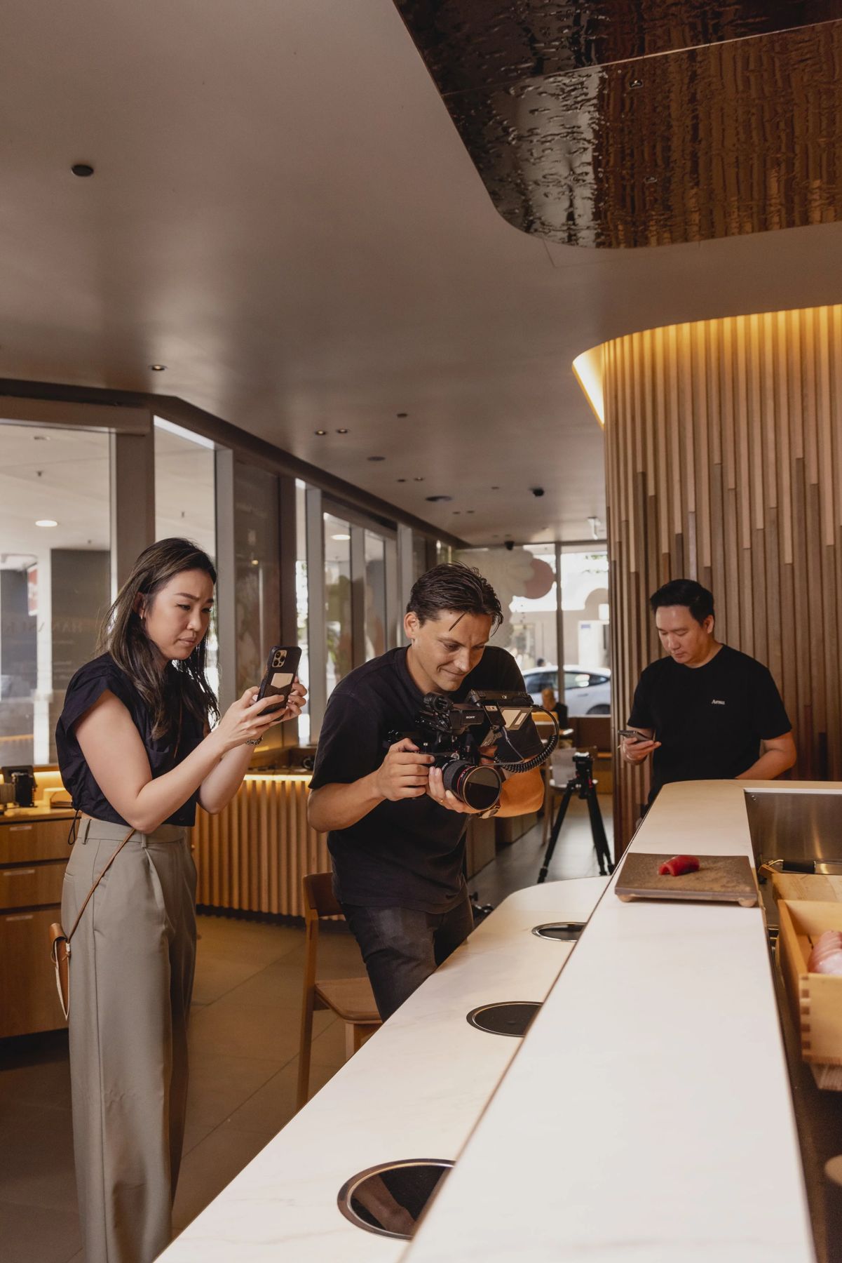 Culture Content filming a chef and host at a restaurant bar
